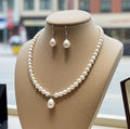 Set Collana e Orecchi con perla naturale in Oro Bianco 18k